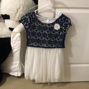 Blue and white dress with flower decoration